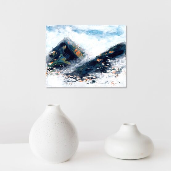 Blue, green and hints of orange and yellow marbled abstract mountain against a wispy white cloudy back ground with bits of blue sky peeking through original painting frameless, hung on a white wall above a white shelf with two odd shaped white vases with light brown speckles in the pottery