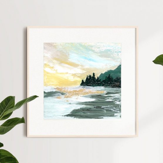 sunny west coast landscape with mountains and forest against the yellow sky and wild ocean framed in natural wood on a white wall with indoor plants