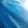 Texture Detail 1 of large landscape painting with textured flowing blue mountains against a lavender and pink sunset sky