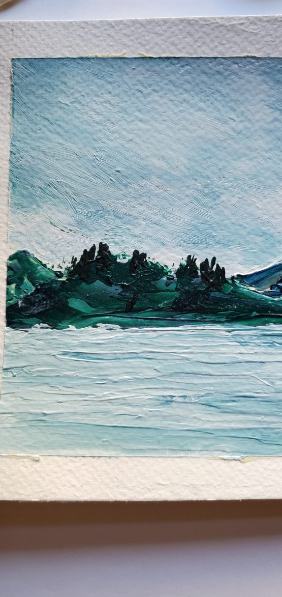 Misty Lake Painting with dark green wooded mountains and mist steaming off of the hills against a grey sky and grey water