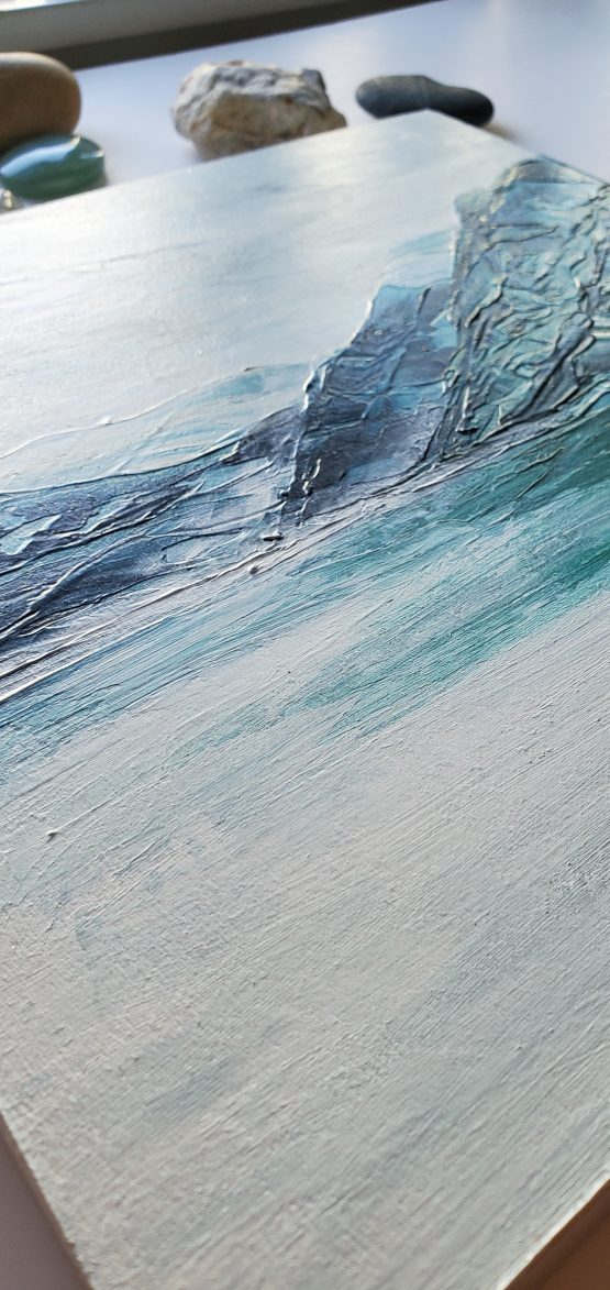 detail of misty pnw lake painting with blue and white mountains and water
