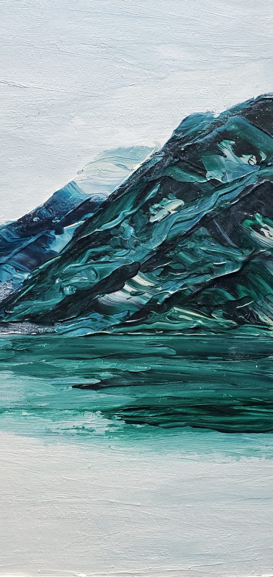 detail of misty pnw lake painting with blue and green mountains and white and bluewater