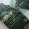 Detail Misty tree painting with dark green trees on a grey lake painting