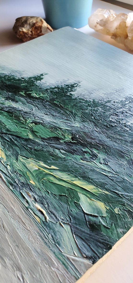 Up close texture detail of Misty Beach painting with dark green foliage and trees shrouded in mist along a dark sandy beach
