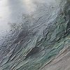 up close texture detail of Misty Beach painting with dark green foliage and trees shrouded in mist along a dark sandy beach